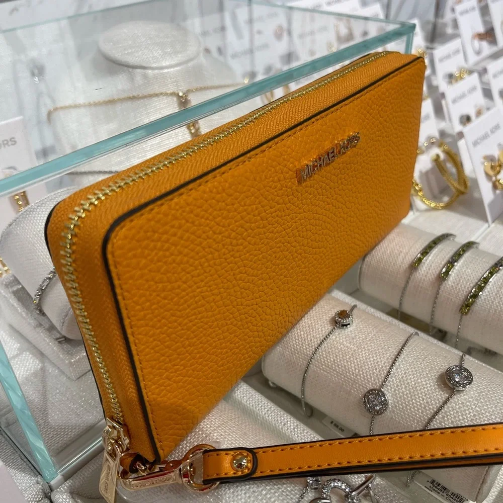MICHAEL KORS Jet Set Travel Lg Pebbled Leather Continental Wristlet
Rad Orange - Picture 12 of 16